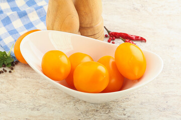 Sweet ripe yellow tomato in the bowl
