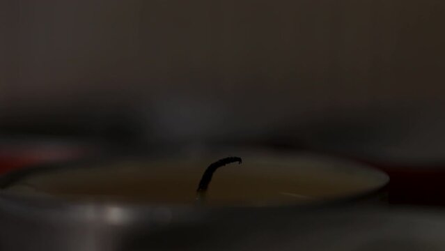 Blowing out the fire of candles, macro shot. Detail shot putting out the flames of some candles.