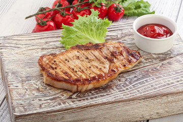 Grilled pork steak with ketchup