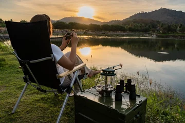 Foto op Canvas Aziatische vrouw reizen en kamperen alleen in natuurpark in Thailand. Recreatie en reis outdoor activiteit levensstijl. © graphixchon
