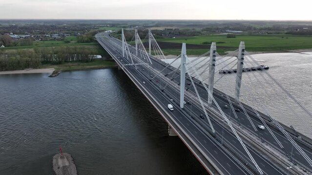 Road surface and traffic on Tacitusbrug bij Ewijk modern suspension bridge crossing the river Waal near Nijmegen, the Netherlands Holland Europe. Valburg and Ewijk.