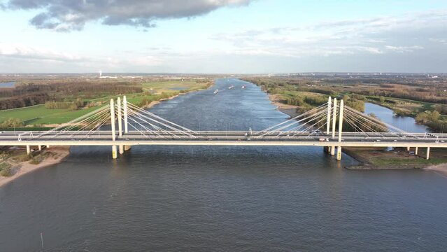 Road surface and traffic on Tacitusbrug bij Ewijk modern suspension bridge crossing the river Waal near Nijmegen, the Netherlands Holland Europe. Valburg and Ewijk.