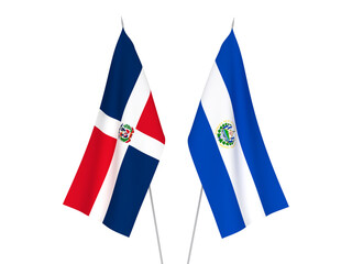 National fabric flags of Dominican Republic and Republic of El Salvador isolated on white background. 3d rendering illustration.