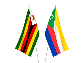 National fabric flags of Zimbabwe and Union of the Comoros isolated on white background. 3d rendering illustration.