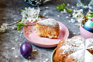 Homemade  Italian style  Easter  bread cake, spring blossom  and  hand colored eggs. Homemade pastry.  Easter holiday baking and decorarion