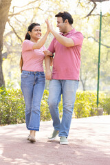 Fototapeta premium Beautiful couple admiring view at park