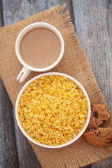 Close-Up of crunchy Indian mixture snacks with hot tea or Coffee time and handmade cookies (biscuits).