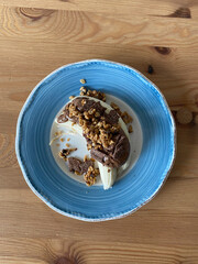 Protein Raw Breakfast with Banana, Granola, Peanut Butter and Cereal Grains.