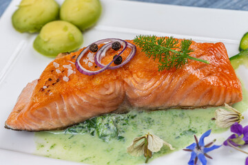Steamed salmon and vegetables. with sorrel sauce minimalist photo