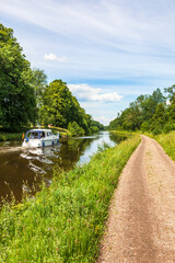 Göta Canal in sweden with a boat in a summer day