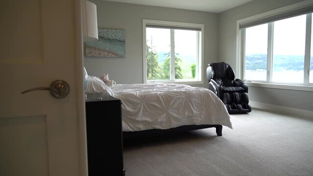 Bed room and a sofa to rest. Large windows facing the forest.