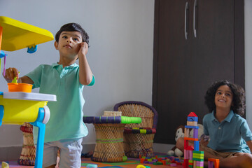Children playing with toys in living room