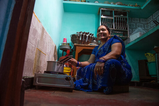 Senior woman making tea in the kitchen