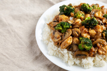 Homemade Chicken Veggie Stir Fry with White Rice, side view. Copy space.