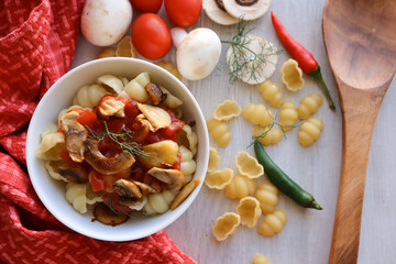 pasta with vegetables. Mushroom pasta dish with gnocchi pasta shells 