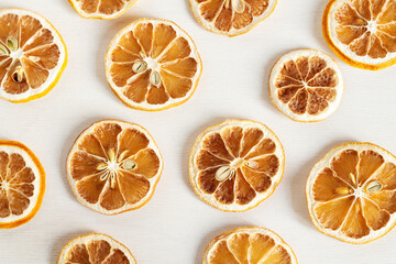 Dried slices of lemons on white background