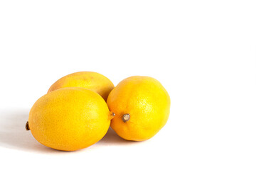 Three fresh lemons isolated on white background