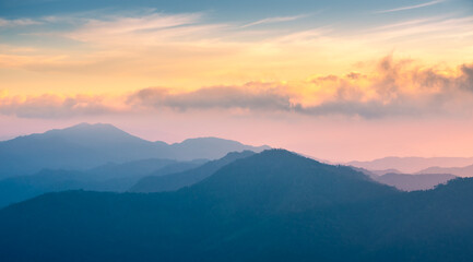 mountain background with colorful sky. rainforest in winter season with mountain range, pine tree in the jungle. stunning landscape in the world. south east Asia nature with national park. camping.