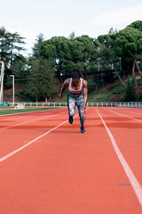 Fototapeta premium Young black athlete sprinter running