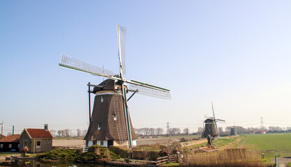 Fototapeta na wymiar Windmill as working dry pumping of the Tweemanspolder, System named Molenviergang in Zevenhuizen