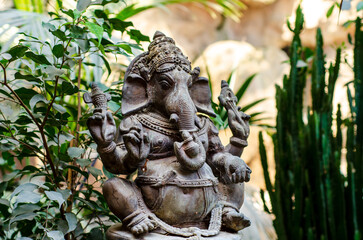 Fototapeta na wymiar Ganesha metal figure in the jungle