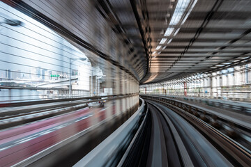 Long exposure motion blur from Yurikamome Monorail line in Tokyo, Japan. Abstract for Digital, Technology, Futuristic Transportation, Computer Network, and Communication concept.