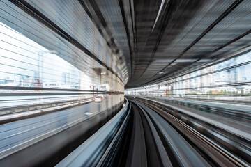 Fototapeta na wymiar Long exposure motion blur from Yurikamome Monorail line in Tokyo, Japan. Abstract for Digital, Technology, Futuristic Transportation, Computer Network, and Communication concept.