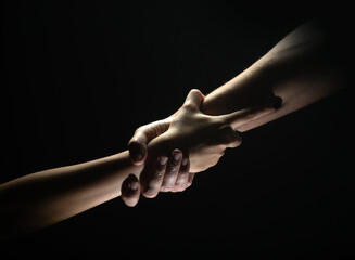 Two trength ands. Helping hand to a friend. Rescue or helping gesture of hands. Concept of...