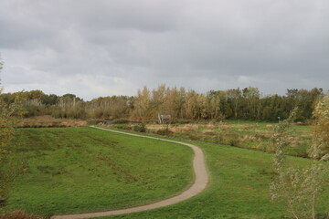 Fototapeta na wymiar Meadows along dyke and rivers of the Hollandsche IJssel in Nieuwerkerk aan den IJssel