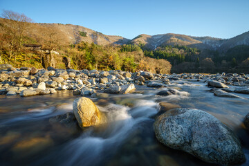 Snow melt rapids of Shokawa River from surrounding Alpine mountains during autumn, Shirakawa-go (White River Village), Takayama, Japan