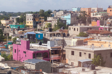 Fototapeta na wymiar Colorful living houses in poor district of Santo Domingo, aerial view