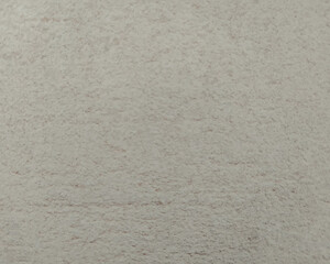A plaster beige wall texture. Abstract background. A concrete painted wall.