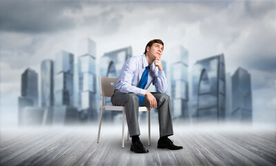Young businessman sitting on an office chair