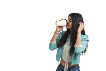 Young Venezuelan woman drinking coffee, isolated.