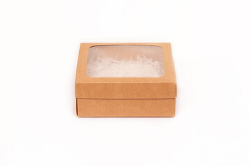 Mocap. Gift box made of cardboard and a transparent window on top on a white background.