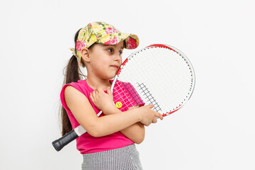Cute little girl with tennis racket on white background.