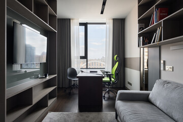 Fototapeta na wymiar modern office in dark colors, comfortable workplace