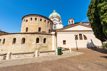 Fototapeta na wymiar Brescia downtown. Old and new Cathedral of Santa Maria Assunta (Duomo Vecchio and Duomo Nuovo) in Romanesque and late Baroque style, Cathedral square or Paolo VI square. Lombardy, Italy, Europe.