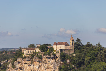 Naklejka premium Panoramic view of bishop palace or Rocamadour castle on cliff.&nbsp;Lot, Occitania, Southwestern France