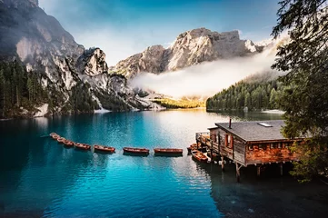 Photo sur Plexiglas Dolomites Boats on the Braies Lake, Pragser Wildsee in Dolomites mountains, Sudtirol, Italy dolomite.