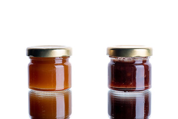 a lot of banos with jam on a white isolated background with reflection