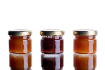 a lot of banos with jam on a white isolated background with reflection