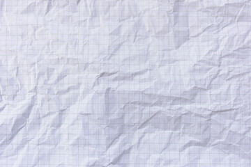 Square crumpled square graph paper on the background.