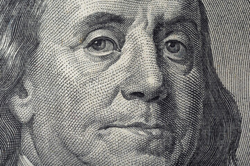 Portrait of Ben Franklin on the US 100 dollar bill in macro. Benjamin Franklin on hundred dollar...