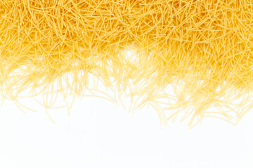 Uncooked vermicelli pasta on white background. Raw dry filini vermicelles. - obrazy, fototapety, plakaty