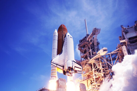 Launch of a space shuttle into space. Elements of this image furnished by NASA