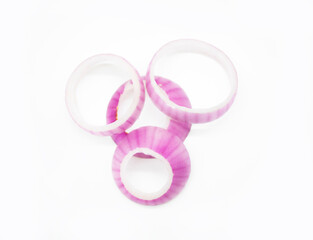 Red onion rings on white background