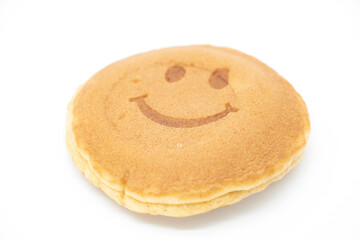 smiley cake on white background , selective focus