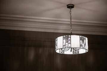 modern lighting in the interior of the house. Big lamp on the ceiling