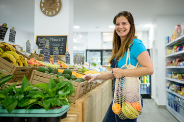 Cheerful woman choosing products in supermarket